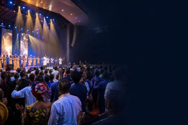 Nigerian gospel worship conference with raised voices