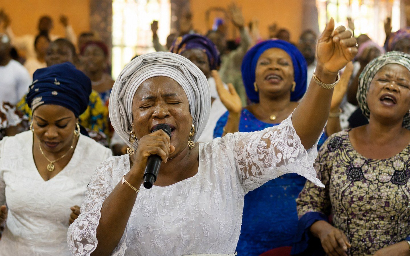 Nigerian gospel worshippers lifting their voices together