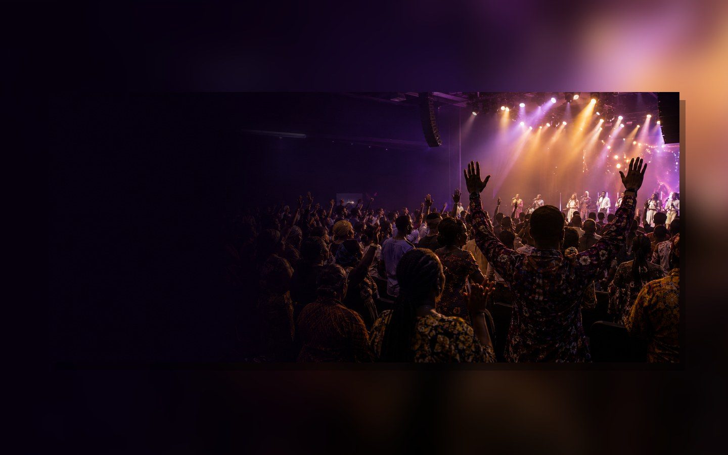 Nigerian gospel worship gathering under stage lights