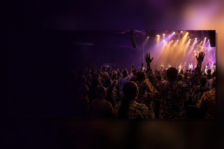 Nigerian gospel worship gathering under stage lights